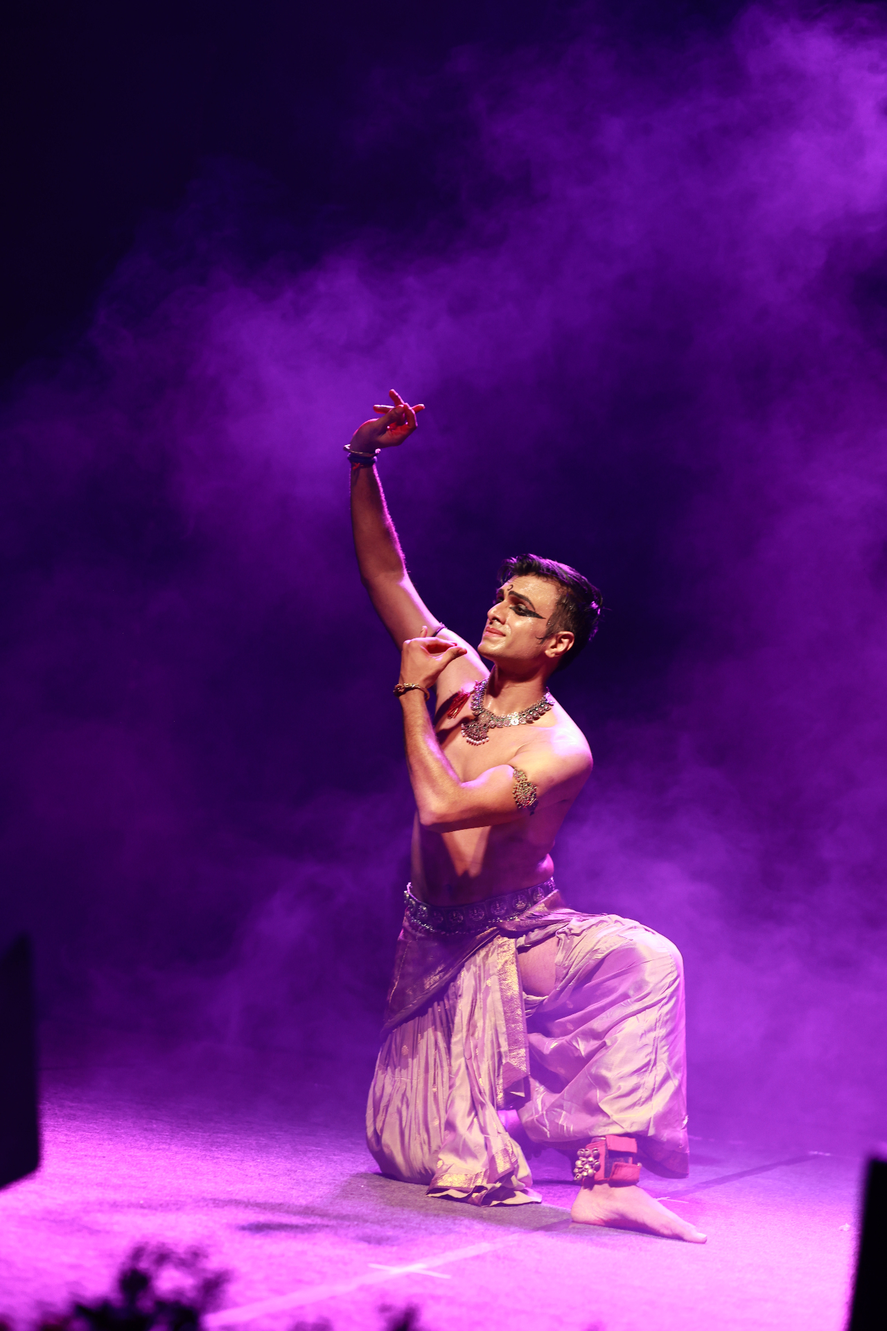 Solo classical dance under the violet wash